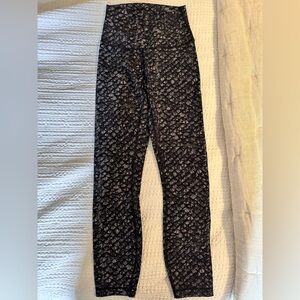 Black Patterned High-Waisted Leggings
Lululemon nulux fabric 
Size 4